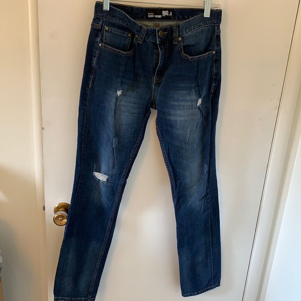 Distressed blue jeans